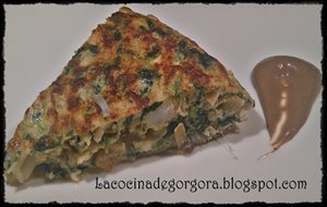 Tortilla De Bacalao Con Espinacas Y Crema De Ajo Negro
